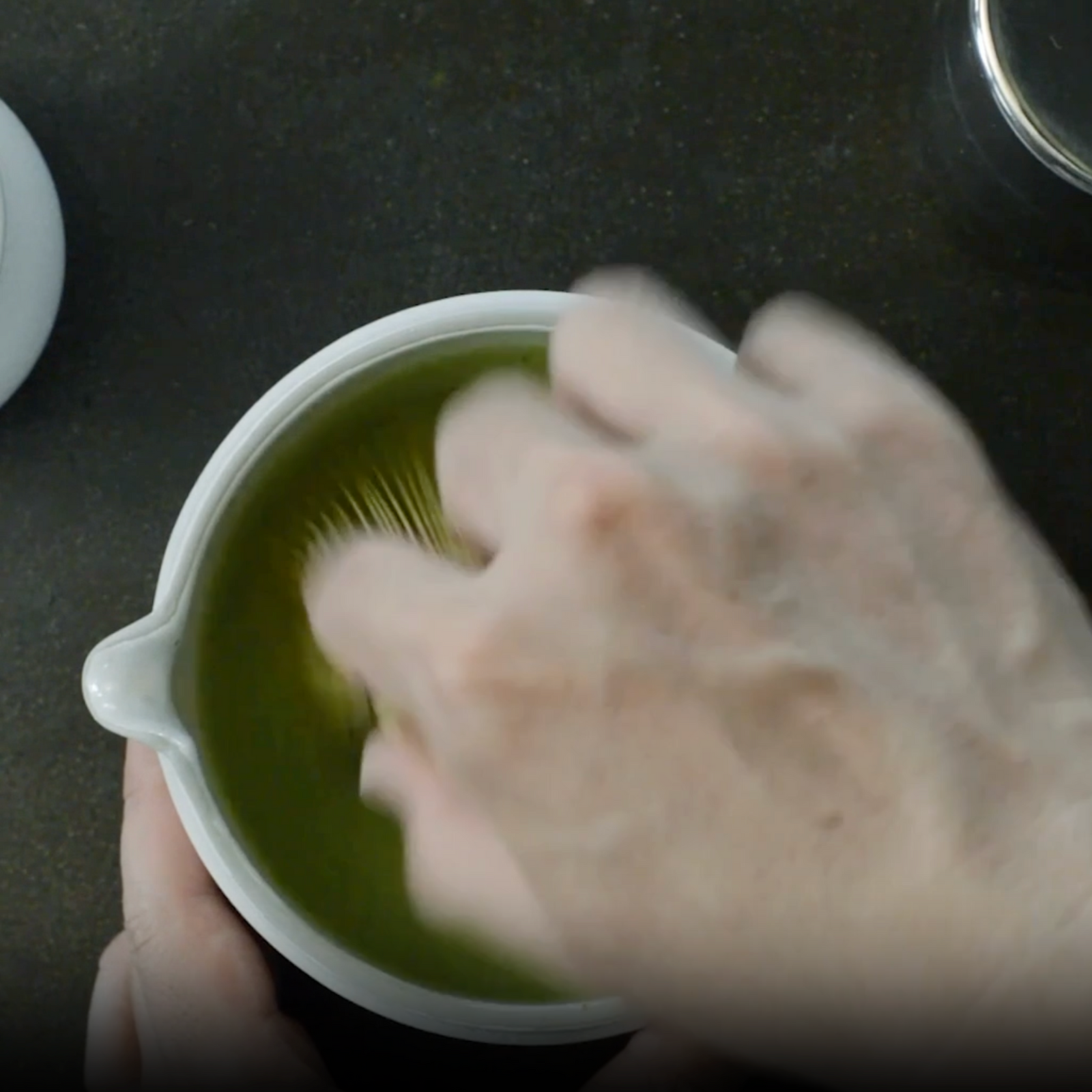 whisking matcha