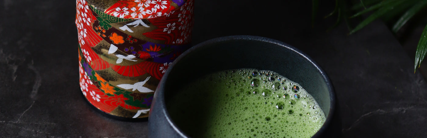 a cup of matcha and a matcha can