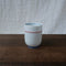 Saikai Ceramics: Red Trim, White Porcelain Yunomi Tea Cup with Blue Accents 150 ml - Yunomi.life